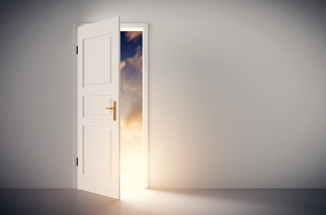 Body - 11 A door opened to the light with clouds in the background.